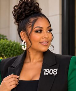 AKA 1908 Drip Pin on model wearing black blazer with green sleeves