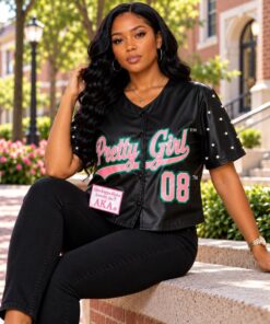 AKA Pretty Girl Vegan Leather Crop Jacket model sitting on bench on campus